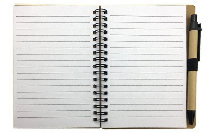 Team using customized spiral bound sticky notes pad during office meeting and planning session