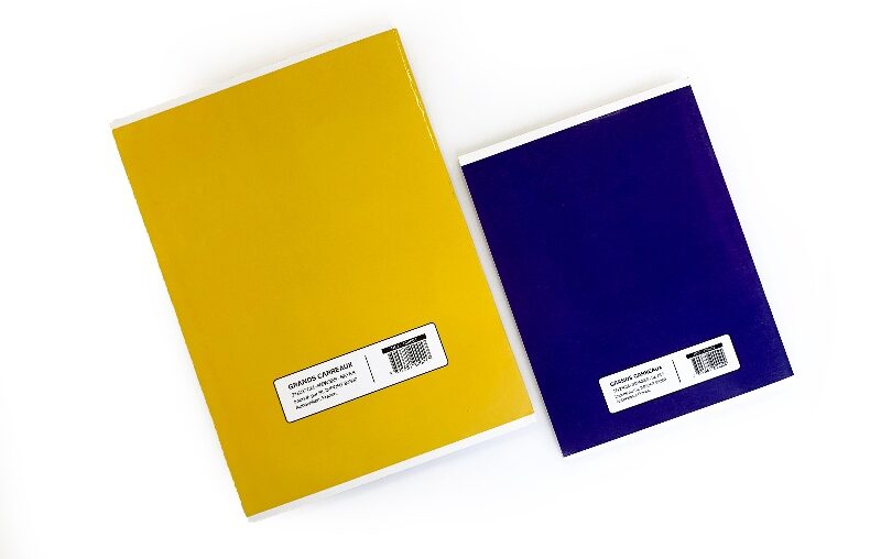 Close-up of a custom logo on a Colorfly exercise book, showing the lay-flat binding.