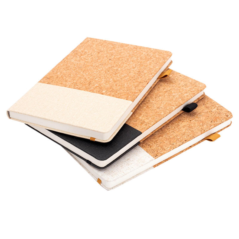 Close-up of the elastic band closure and personalized embossing on the A5 notebook