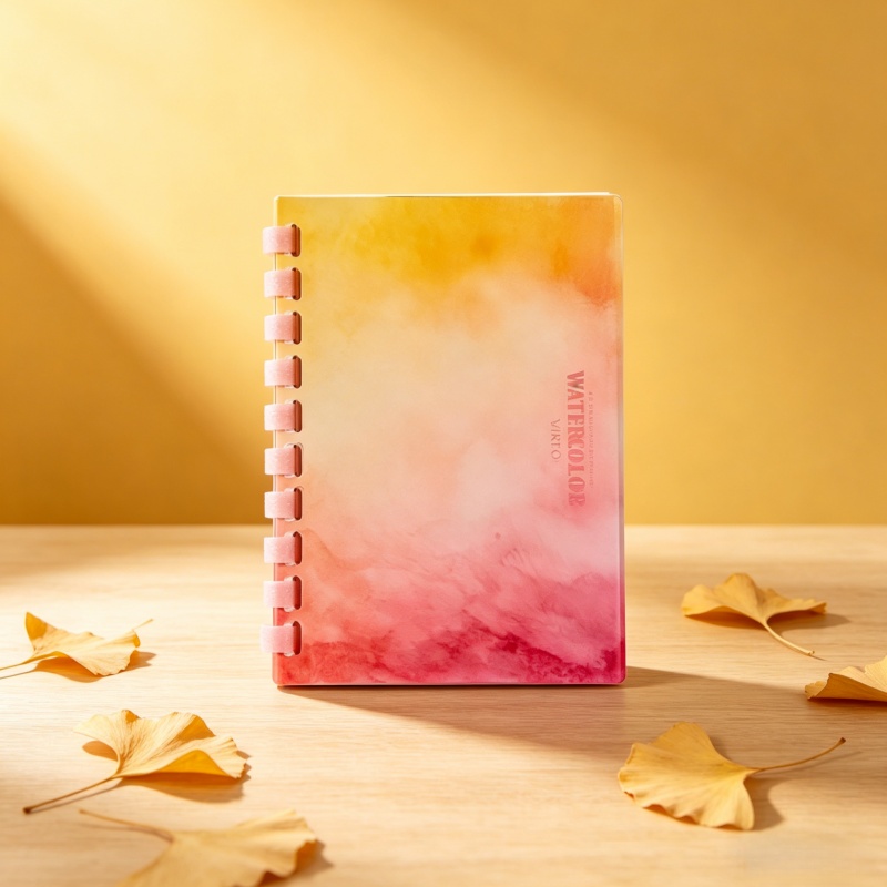 Custom spiral binding notebook with gold foil logo on matte black cover by Colorfly 