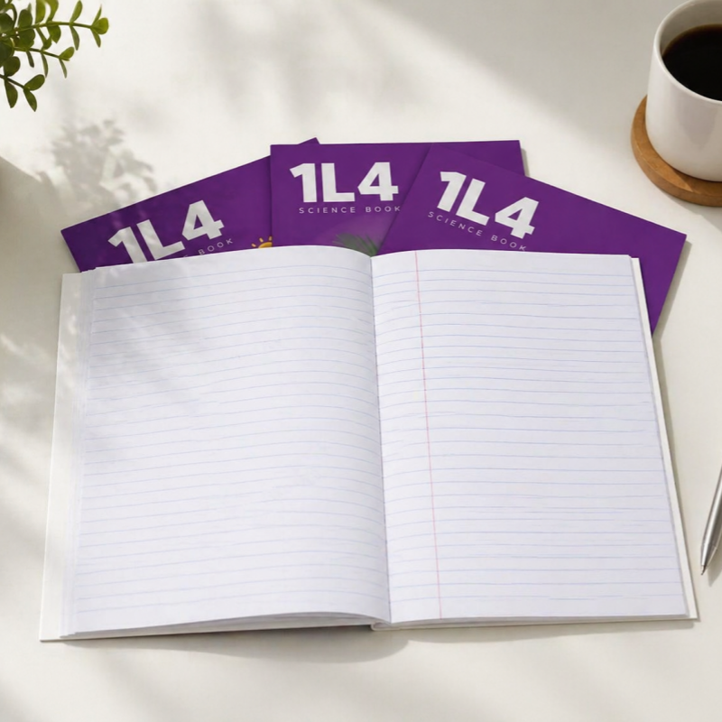 Open A5 stapled exercise book with custom inner page showing ruled lines